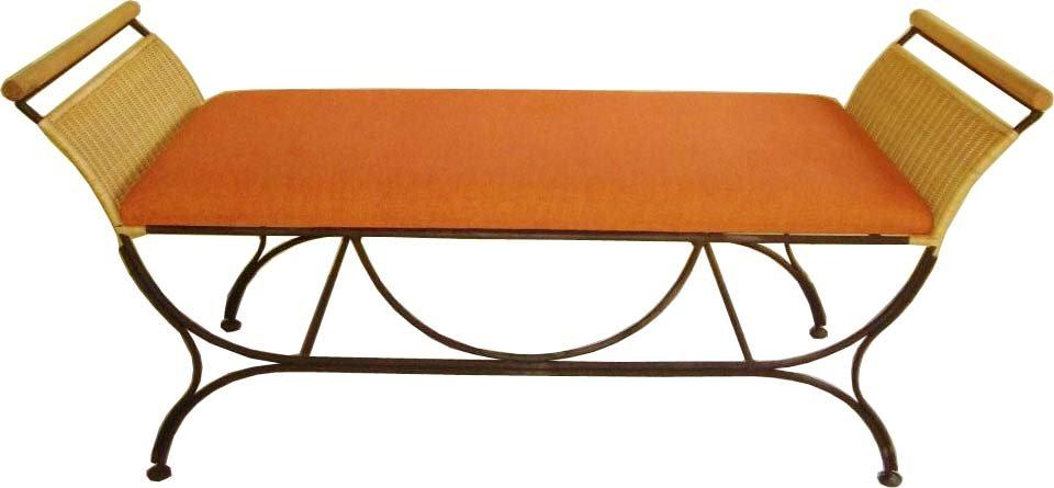 Two seater bench with double armrests made of cane and wood with a comfortable cushion.